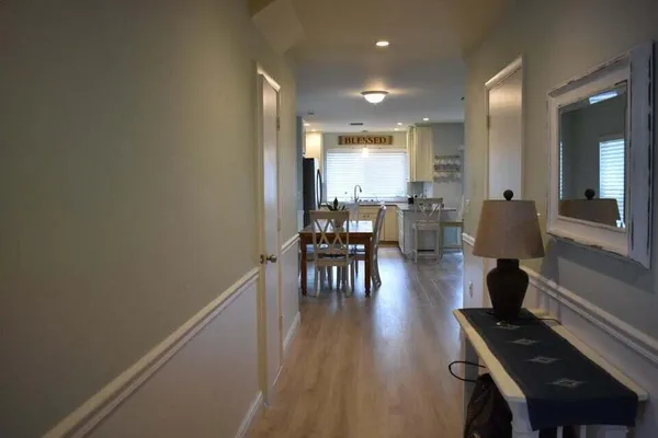 a view of dining room with furniture and wooden floor