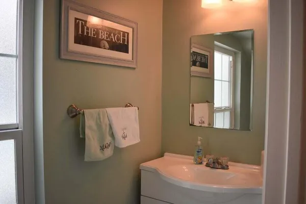 a bathroom with a sink and mirror