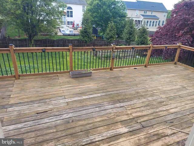 a view of a balcony with wooden floor