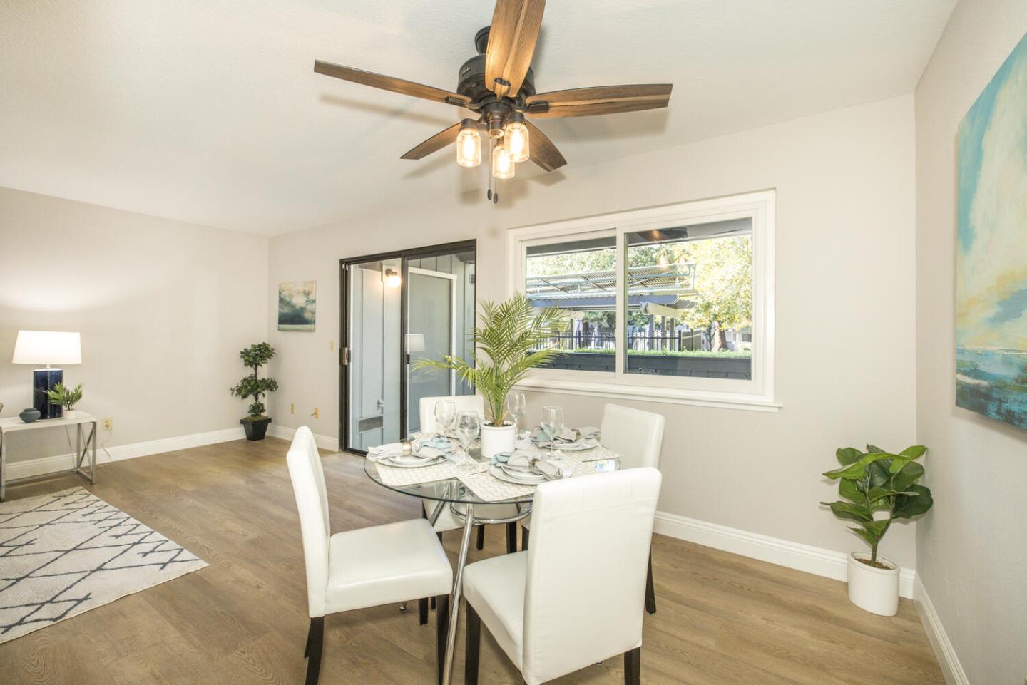 4027 Rector Common Fremont, CA 94538 - Photo 11 of 40 a view of a dining room with furniture window and wooden floor