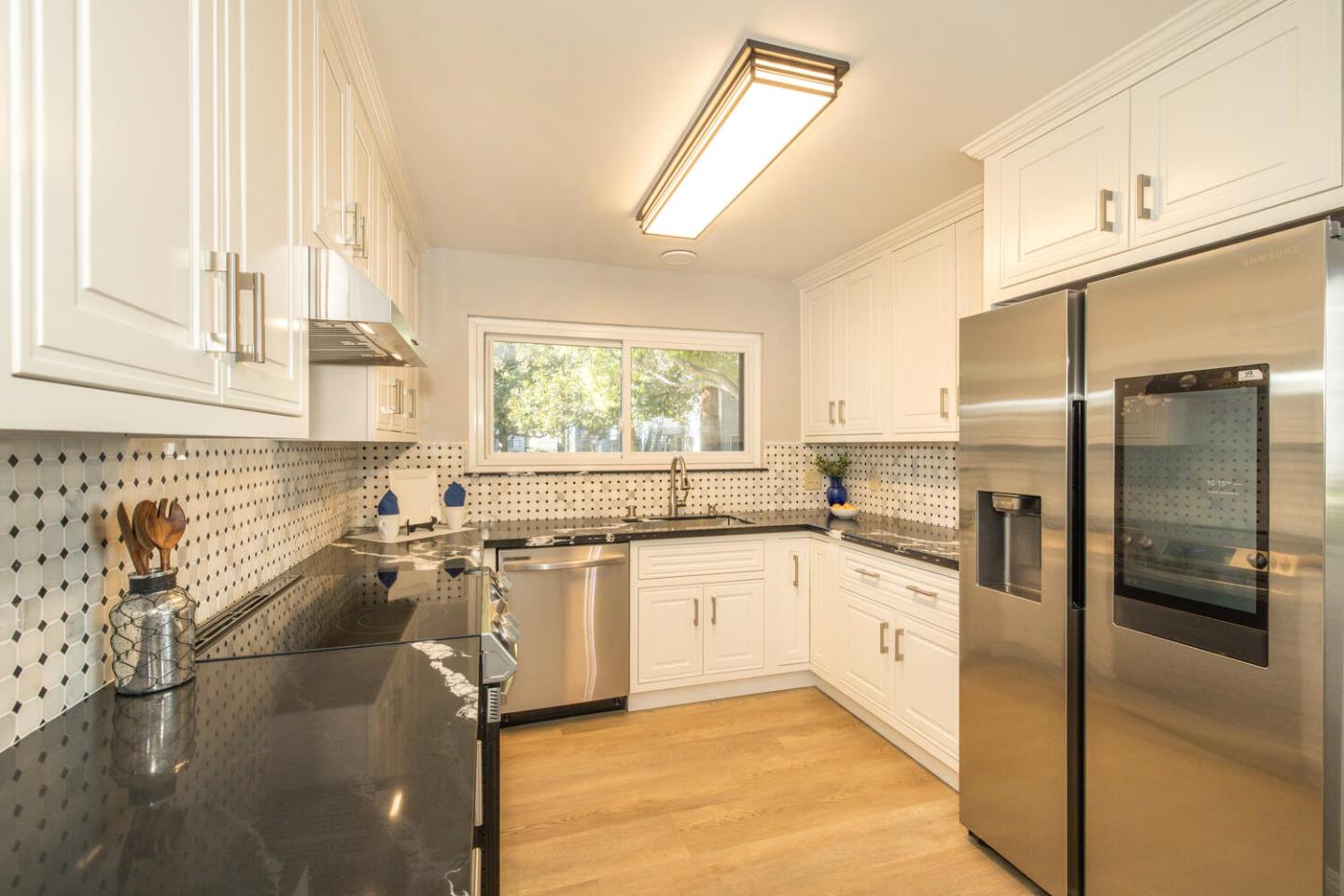 4027 Rector Common Fremont, CA 94538 - Photo 15 of 40 a kitchen with a sink stove and refrigerator