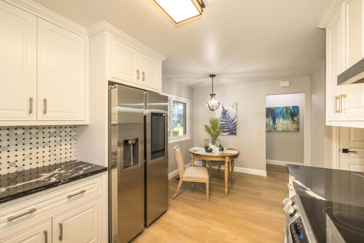 4027 Rector Common Fremont, CA 94538 - Photo 18 of 40 a kitchen with stainless steel appliances granite countertop a refrigerator and a stove top oven
