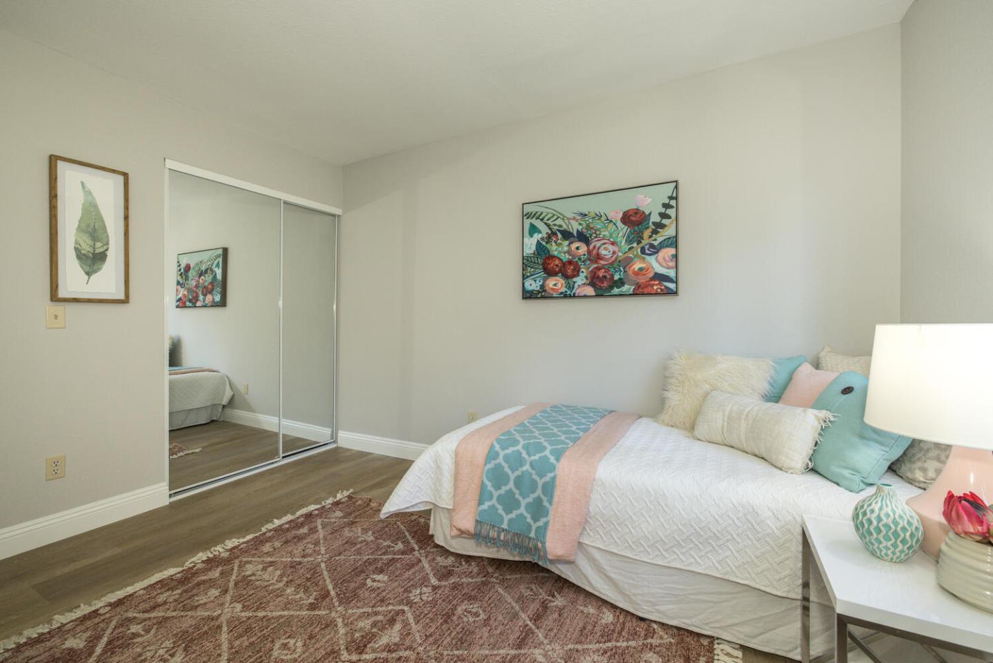 4027 Rector Common Fremont, CA 94538 - Photo 25 of 40 a bedroom with a bed and a painting on the wall