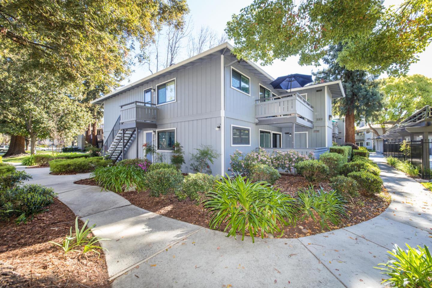 4027 Rector Common Fremont, CA 94538 - Photo 4 of 40 a front view of a house with a garden