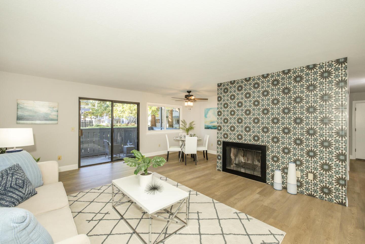 4027 Rector Common Fremont, CA 94538 - Photo 6 of 40 a living room with furniture a fireplace and a table