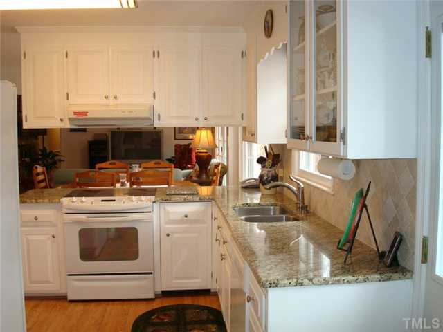 7905 Hollander Place Raleigh, NC 27606 - Photo 20 of 25 New granite counters and tile back splash