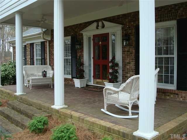 7905 Hollander Place Raleigh, NC 27606 - Photo 2 of 25 Large southern style front porch has dual fans