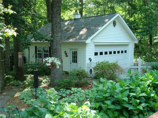 7905 Hollander Place Raleigh, NC 27606 - Photo 4 of 25 Custom detached garage/workshop built in 2002 has front and back garage doors, vinyl siding and full attic w/pull down stairs