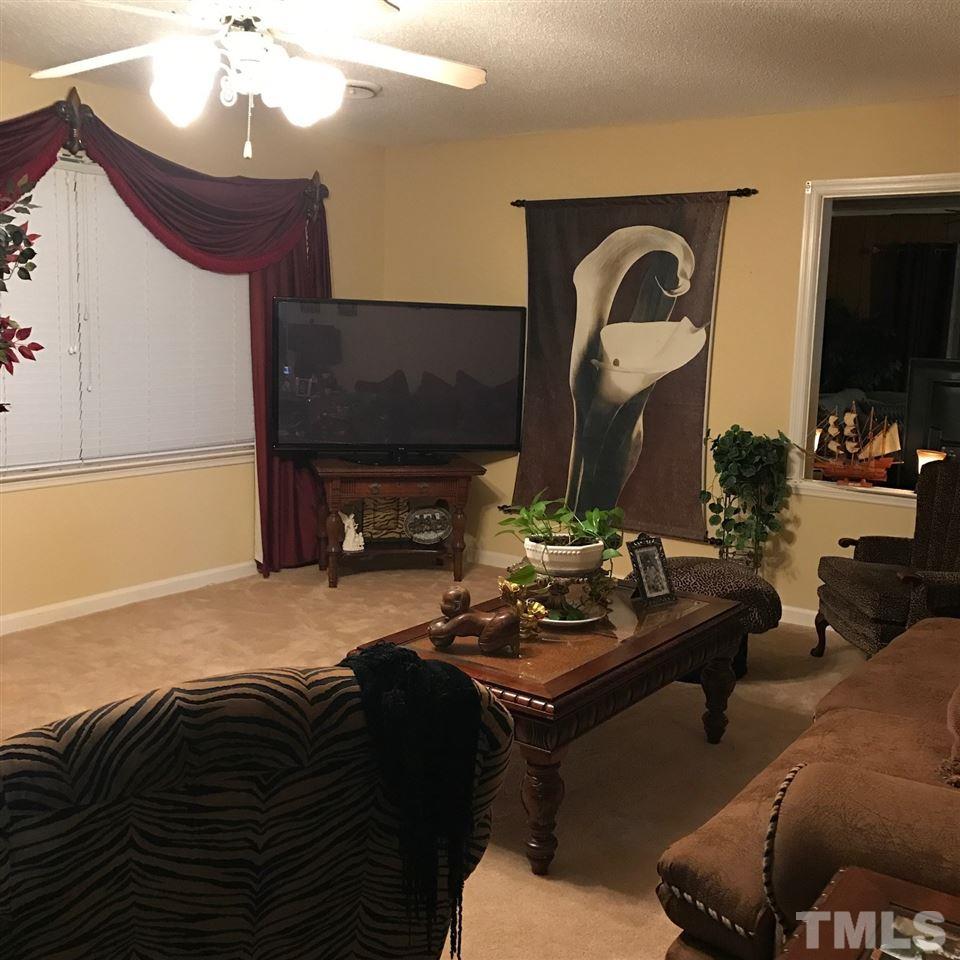 559 Clayton Road Durham, NC 27703 - Photo 3 of 15 a living room with furniture and a fireplace