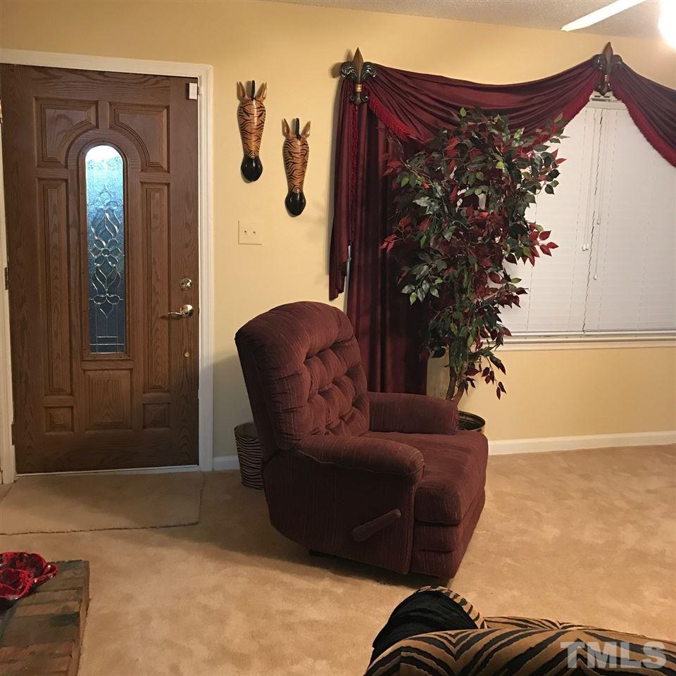 559 Clayton Road Durham, NC 27703 - Photo 4 of 15 a living room with furniture and a potted plant