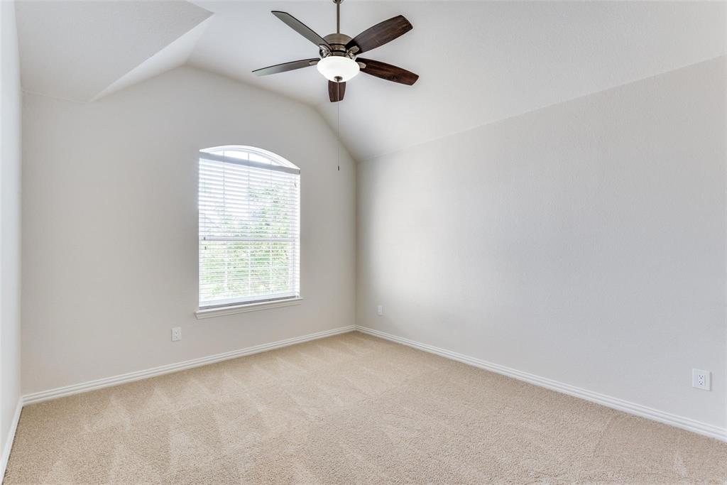 2344 Ranchview Drive Little Elm, TX 75068 - Photo 20 of 24 Room featuring a vaulted ceiling, a ceiling fan with light fixture, and neutral carpeting