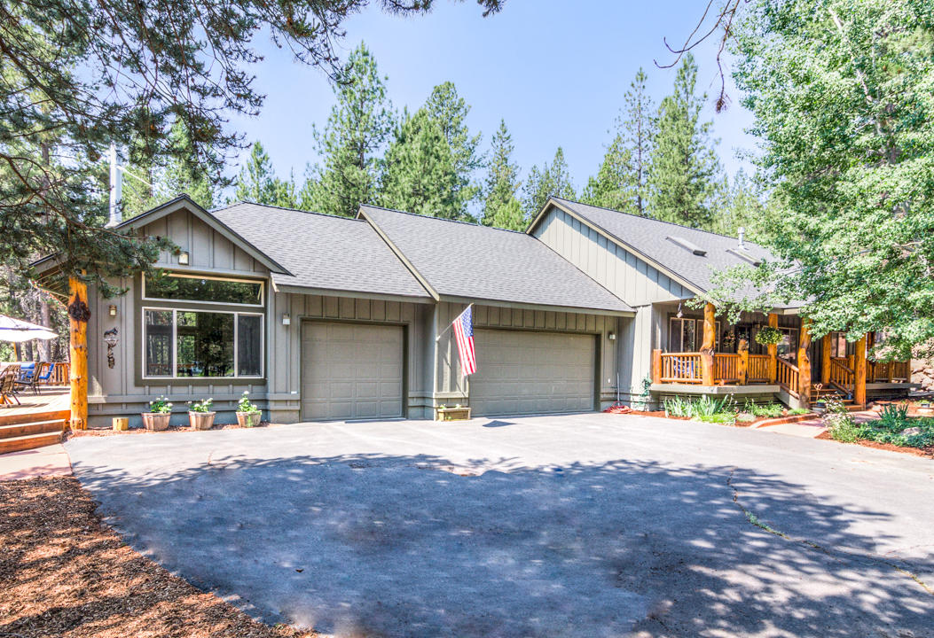 17065 Azusa Road Bend, OR 97707 - Photo 26 of 37 Behind the three car garage is a hallway that leads to a bonus/family room area or could also be used as a media room.