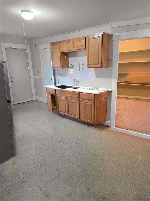 263 Elm Street, Unit 3L Holyoke, MA 01040 - Photo 8 of 12 a large kitchen with stainless steel appliances granite countertop a sink and cabinets