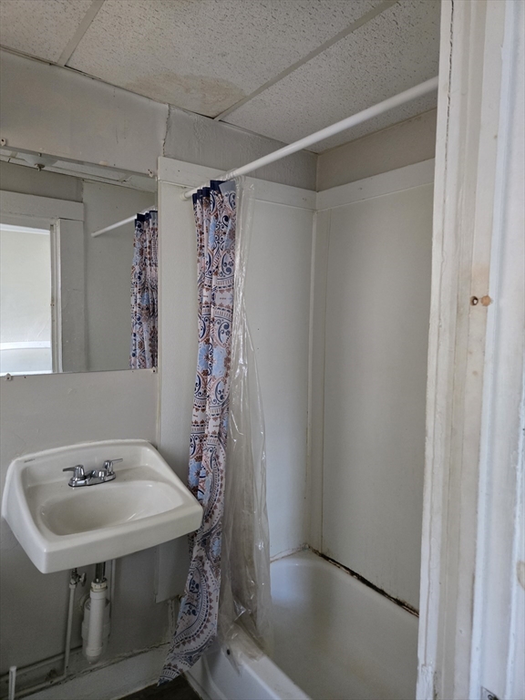 263 Elm Street, Unit 3L Holyoke, MA 01040 - Photo 10 of 12 a bathroom with a sink and a mirror