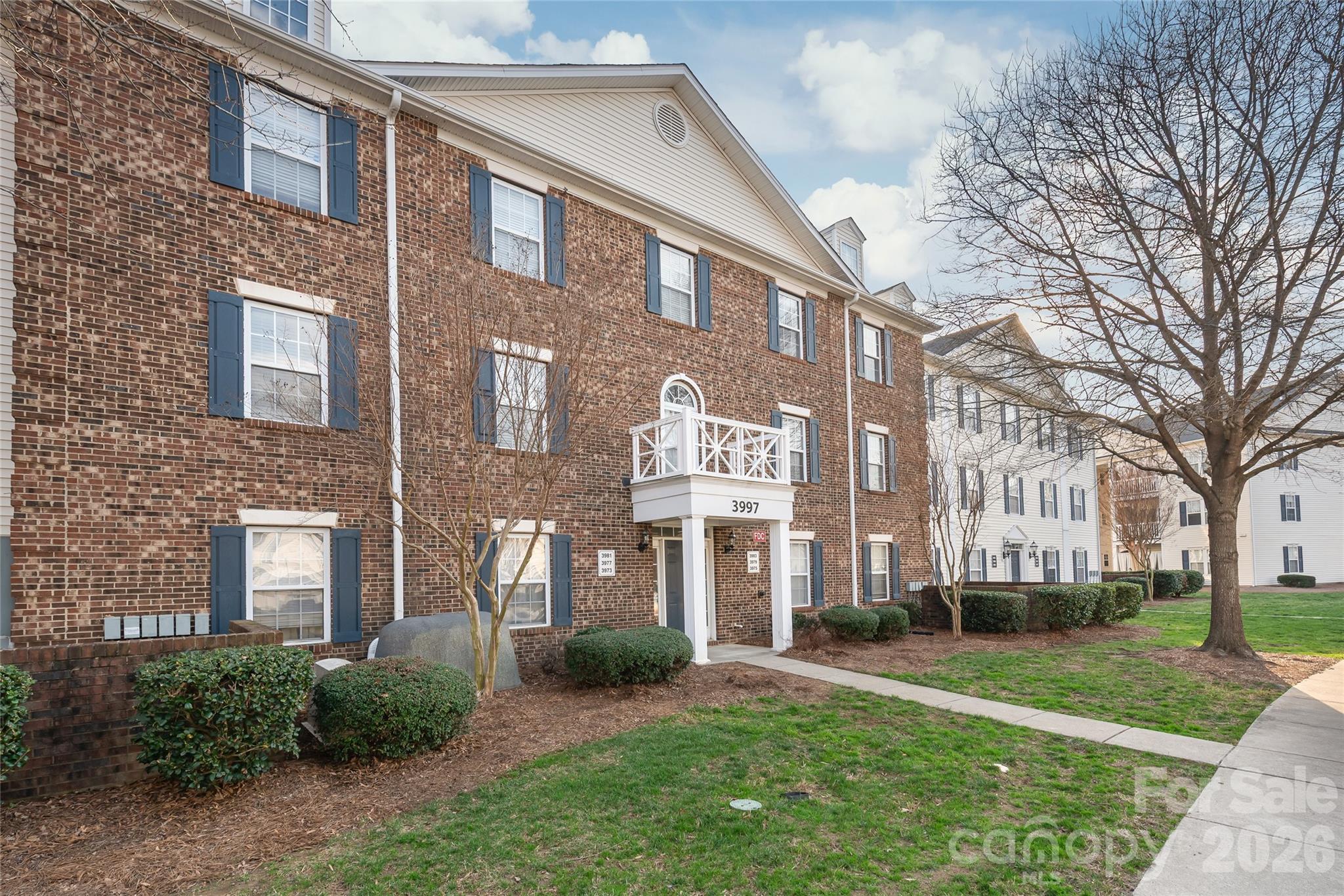 3983 Town Center Road Harrisburg, NC 28075 - Photo 1 of 13 a view of a brick building next to a yard