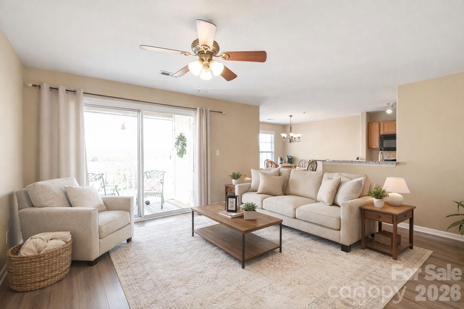 3983 Town Center Road Harrisburg, NC 28075 - Photo 3 of 13 a living room with furniture and a large window