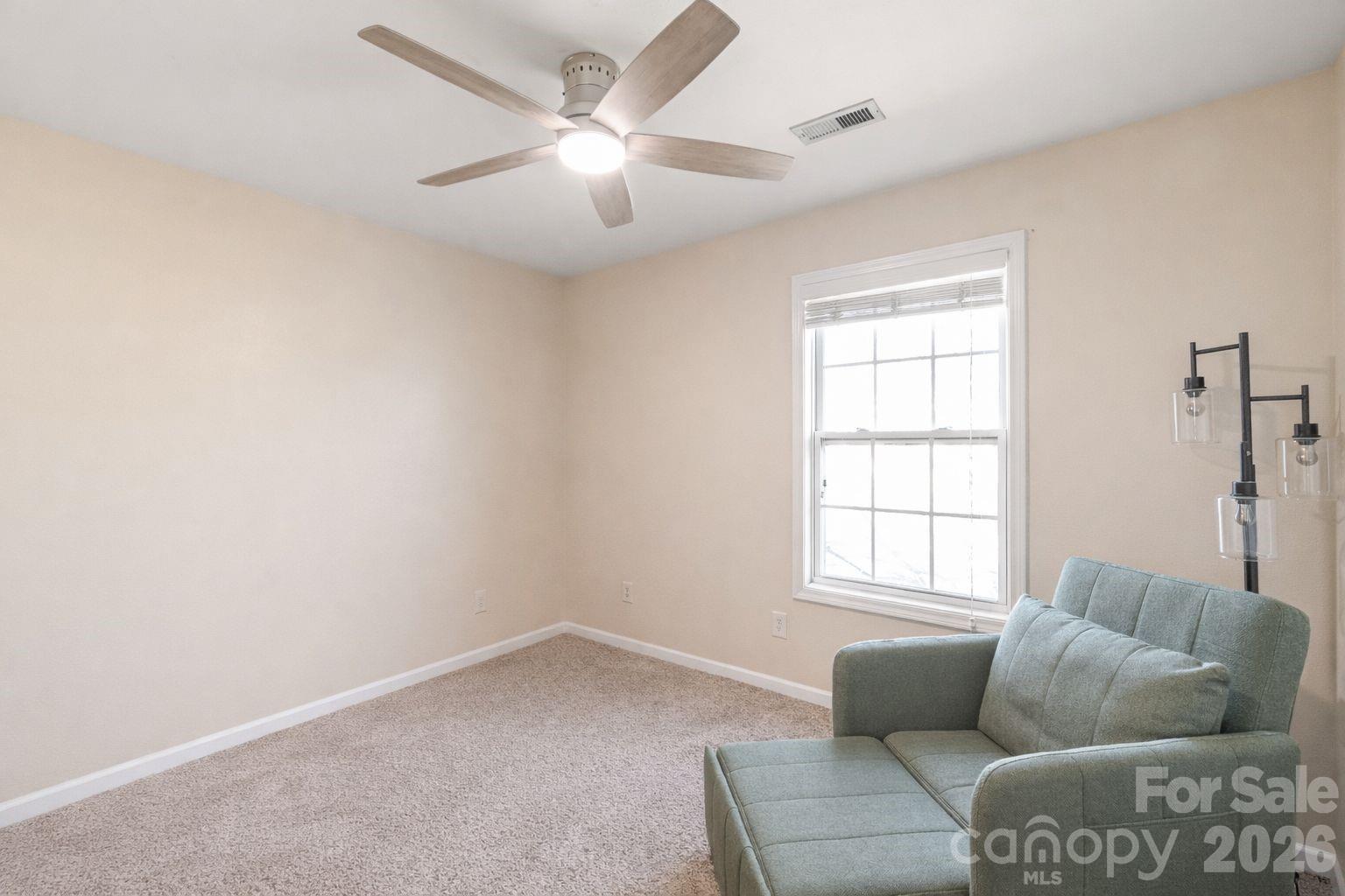 3983 Town Center Road Harrisburg, NC 28075 - Photo 10 of 13 an living room with furniture and a window