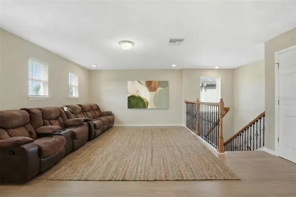 a living room with furniture and a gate