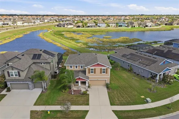 an aerial view of residential houses with outdoor space