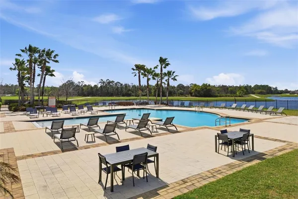 a roof deck with table and chairs a barbeque