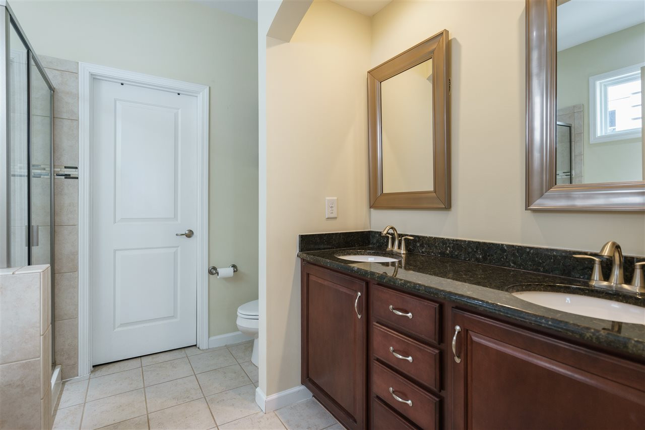 5622 Wade Park Boulevard Raleigh, NC 27607 - Photo 13 of 25 SPACIOUS MASTER BATH INCLUDES DOUBLE SINKS, GARDEN TUB, SHOWER, AND WIC. CERAMIC TILE AND GRANITE COUNTERS! MASTER BATHROM