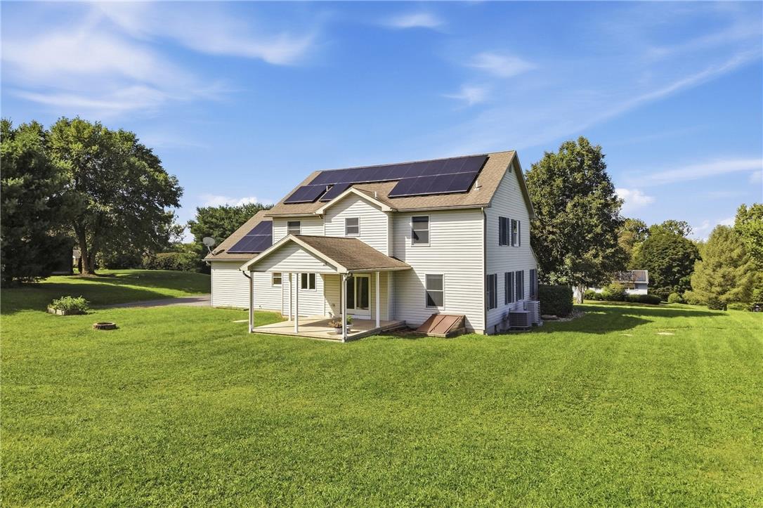 590 Fehr Road Nazareth, PA 18064 - Photo 57 of 79 Solar panels line the roof of this classic multi-level home overlooking an expansive grassy lawn.