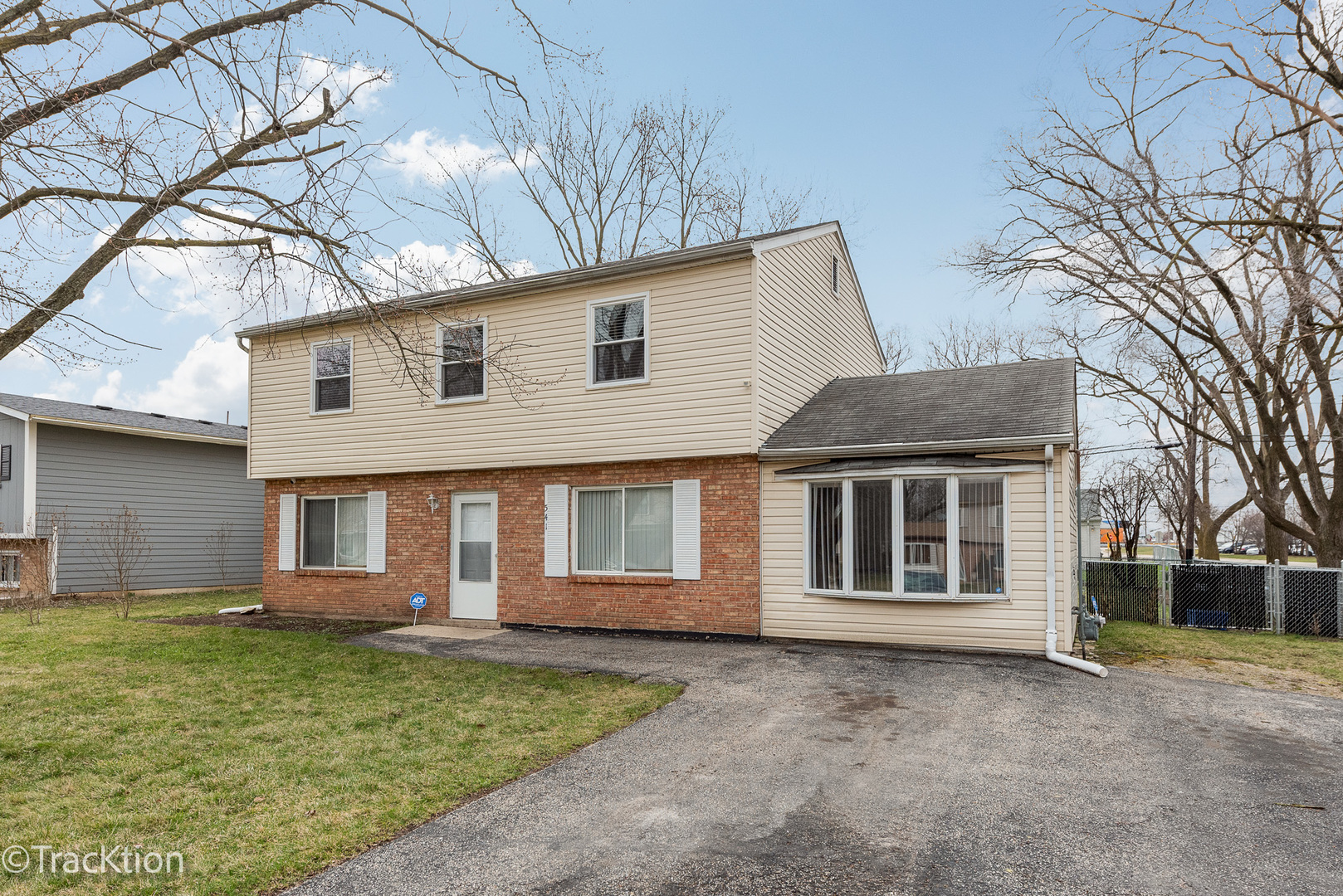 541 Redwood Road Bolingbrook, IL 60440 - Photo 1 of 14 a front view of a house with a garden