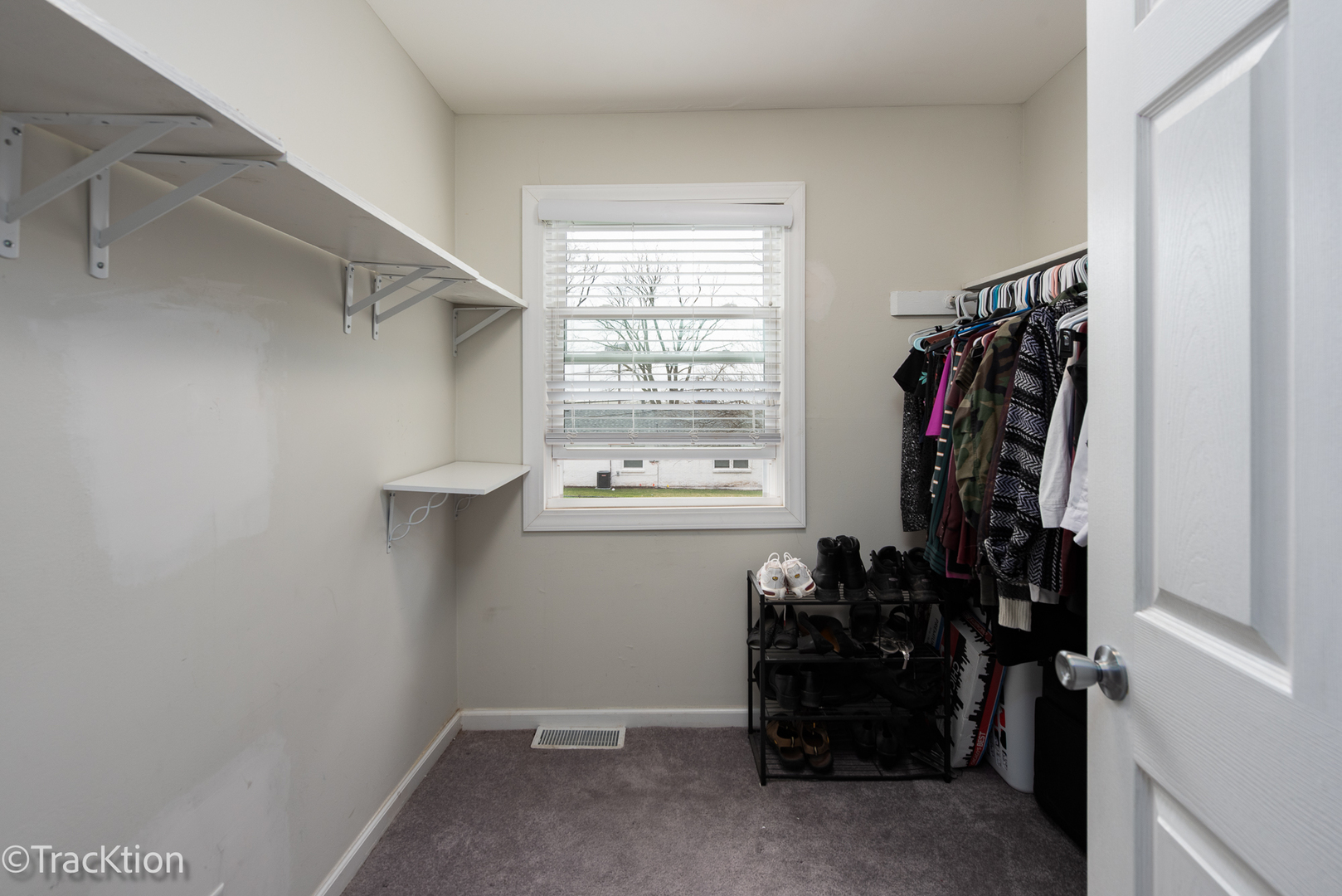 541 Redwood Road Bolingbrook, IL 60440 - Photo 8 of 14 a view of walk in closet with clothes and shoes