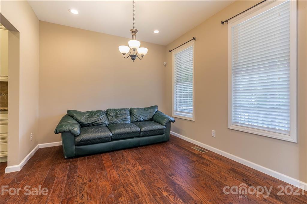 2341 Enola Road Morganton, NC 28655 - Photo 12 of 42 a living room with furniture a dining table and a window