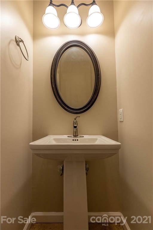 2341 Enola Road Morganton, NC 28655 - Photo 13 of 42 a bathroom with a sink and a mirror