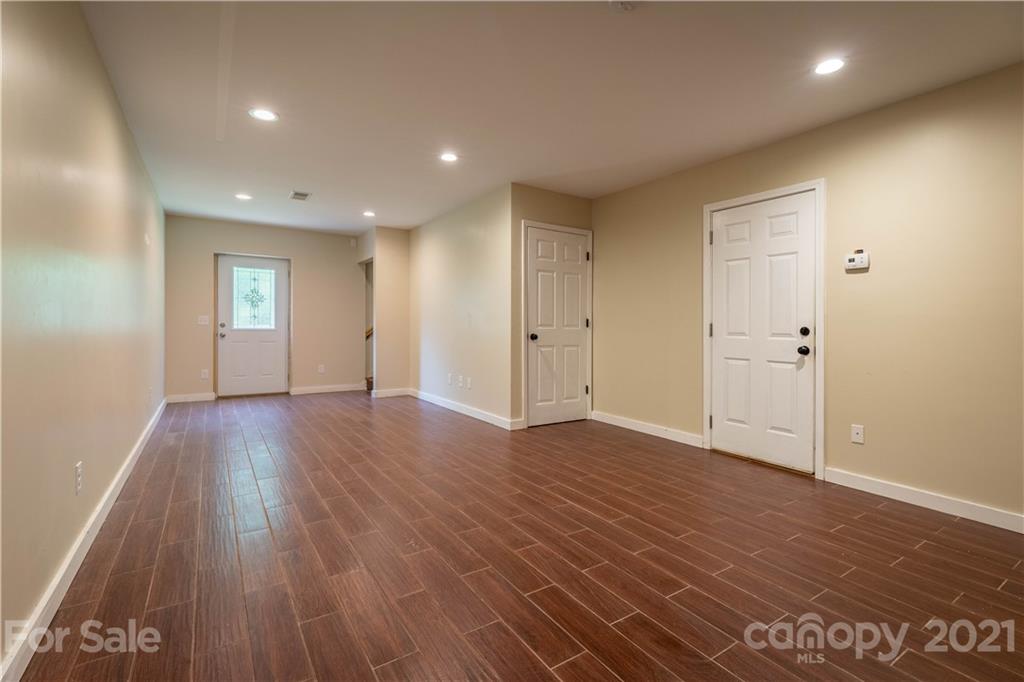 2341 Enola Road Morganton, NC 28655 - Photo 19 of 42 a view of empty room with wooden floor and window