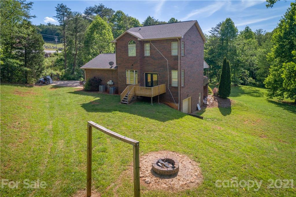 2341 Enola Road Morganton, NC 28655 - Photo 3 of 42 a front view of a house with garden