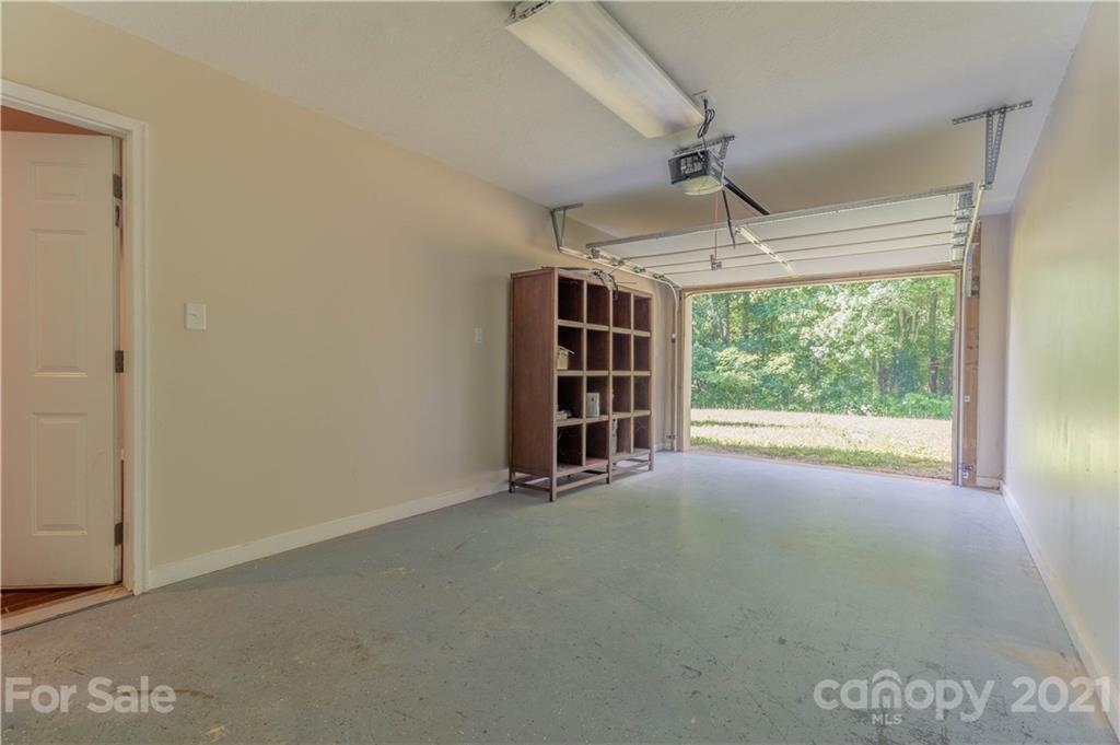 2341 Enola Road Morganton, NC 28655 - Photo 22 of 42 an empty room with windows and outdoor view