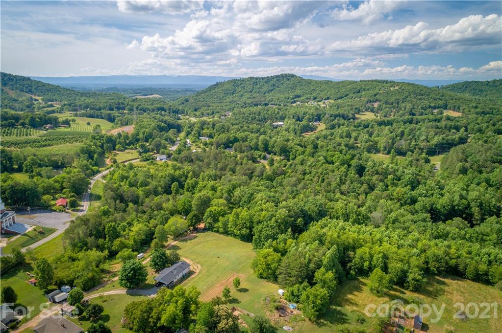 2341 Enola Road Morganton, NC 28655 - Photo 27 of 42 a view of a lake with a building in the background