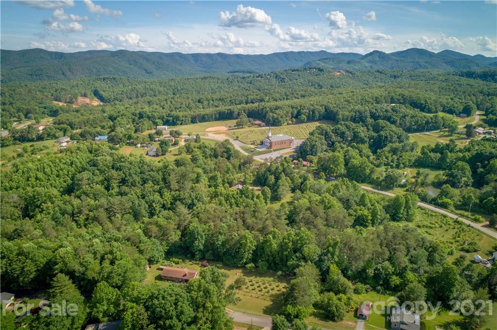 2341 Enola Road Morganton, NC 28655 - Photo 30 of 42 a view of a lush green hillside and houses