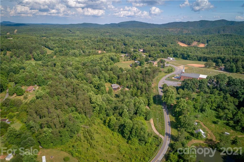 2341 Enola Road Morganton, NC 28655 - Photo 31 of 42 an aerial view of residential houses with outdoor space and trees
