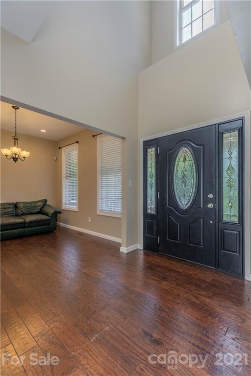 2341 Enola Road Morganton, NC 28655 - Photo 7 of 42 a view of a hallway with a large window and wooden floor