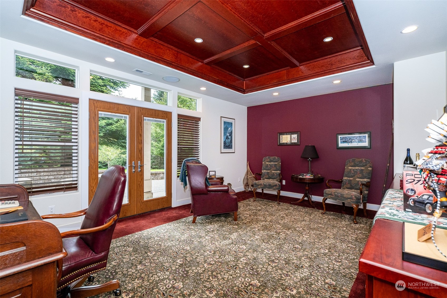 188 Spooner Road Chehalis, WA 98532 - Photo 23 of 40 a living room with furniture a flat screen tv and floor to ceiling window