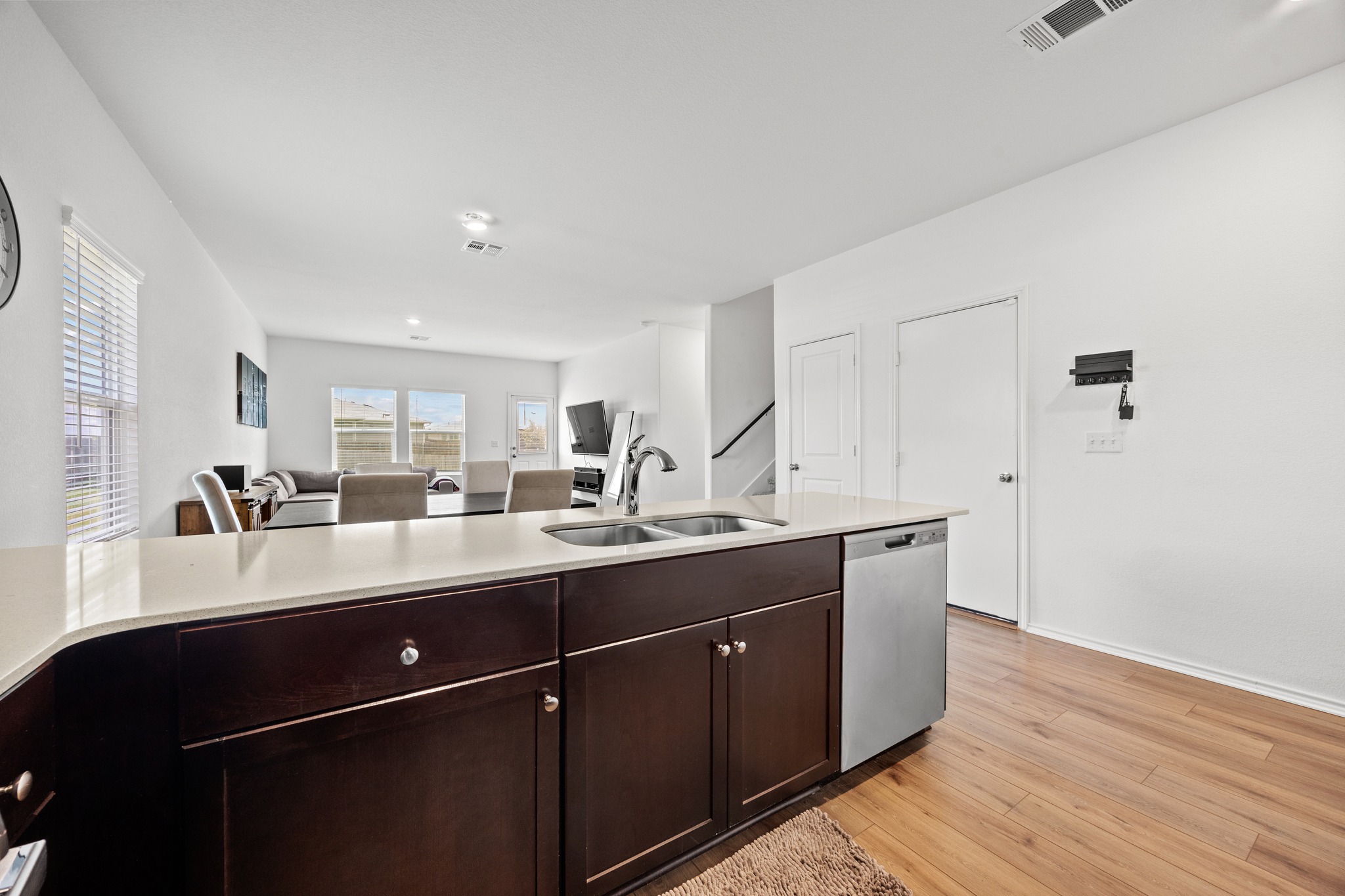 14121 Berning Road Manor, TX 78653 - Photo 7 of 27 A well-lit kitchen island offers convenient prep space and seamlessly connects to the living area.