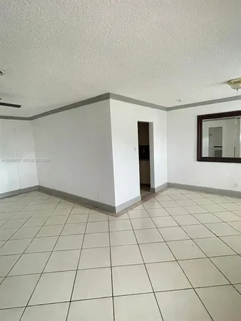 a view of a livingroom with an empty space and a sink