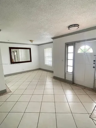 a view of an empty room and window