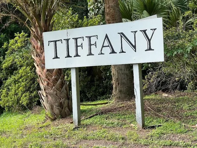 a sign broad in front of a house