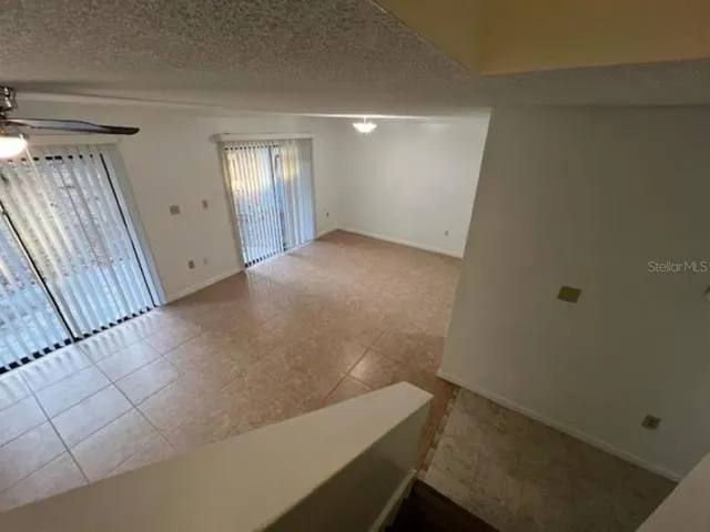 view of room with window and stairs