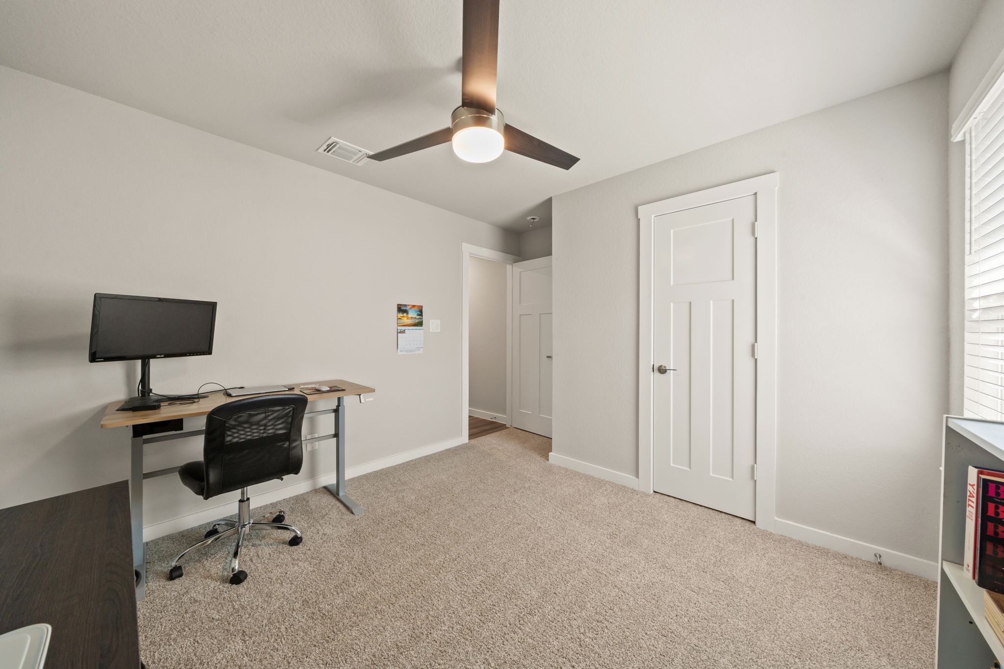 1117 Tipton Street Georgetown, TX 78633 - Photo 31 of 40 Carpeted room featuring a ceiling fan with integrated lighting, white trim and doors, and window blinds