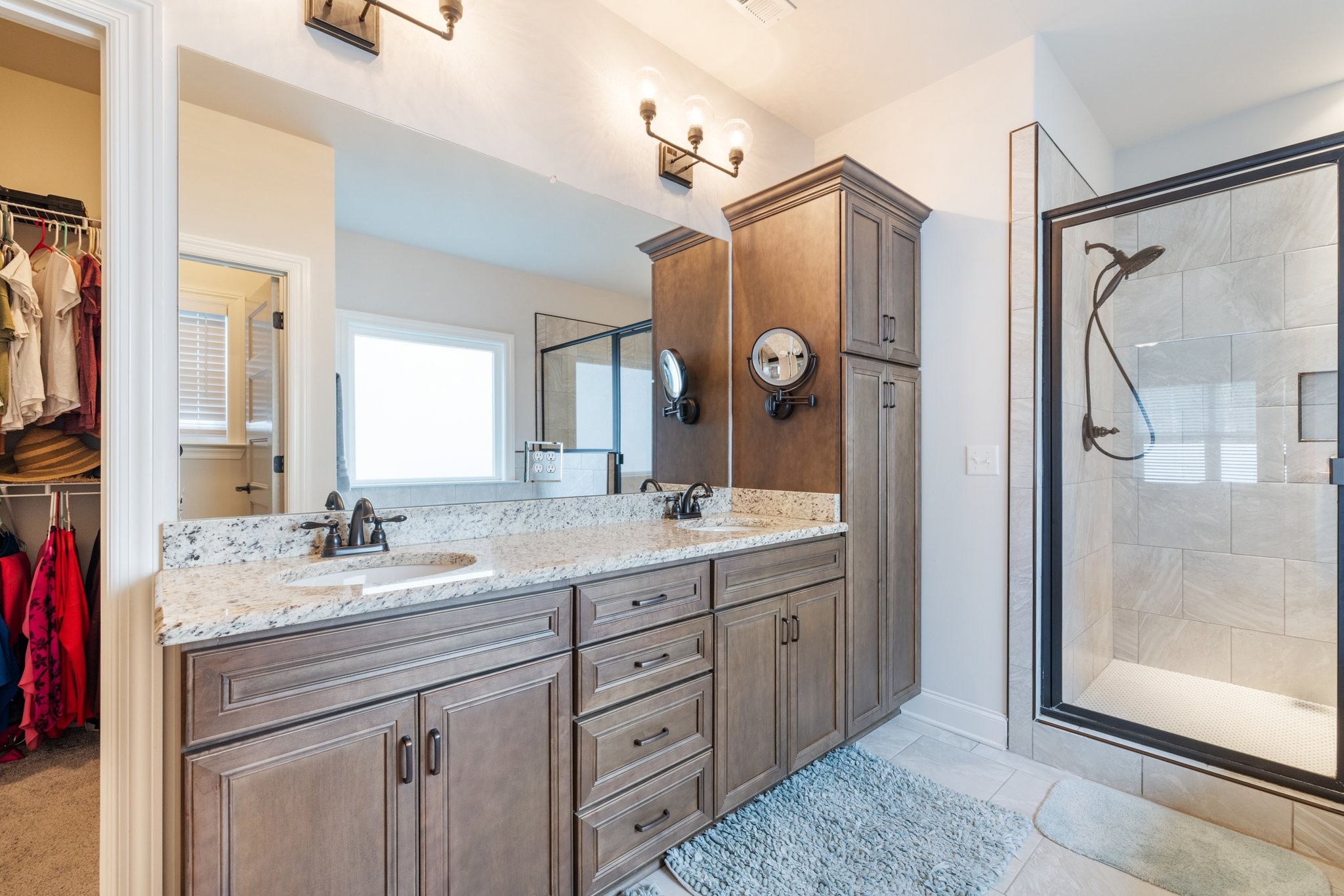 305 McClaran Place Murfreesboro, TN 37129 - Photo 12 of 23 a bathroom with a granite countertop sink mirror and a shower