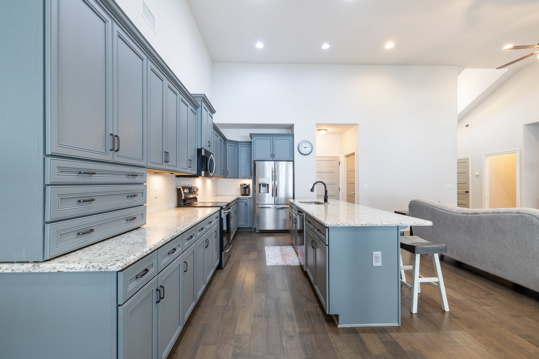 305 McClaran Place Murfreesboro, TN 37129 - Photo 3 of 23 a kitchen with kitchen island granite countertop a sink counter top space and cabinets