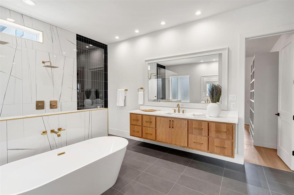 428 Squaw Creek Road Willow Park, TX 76087 - Photo 26 of 34 a spacious bathroom with a double vanity sink mirror and bathtub