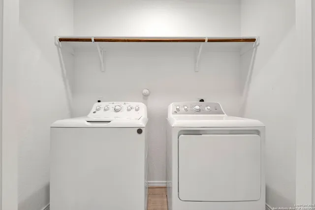 a utility room with dryer and washer