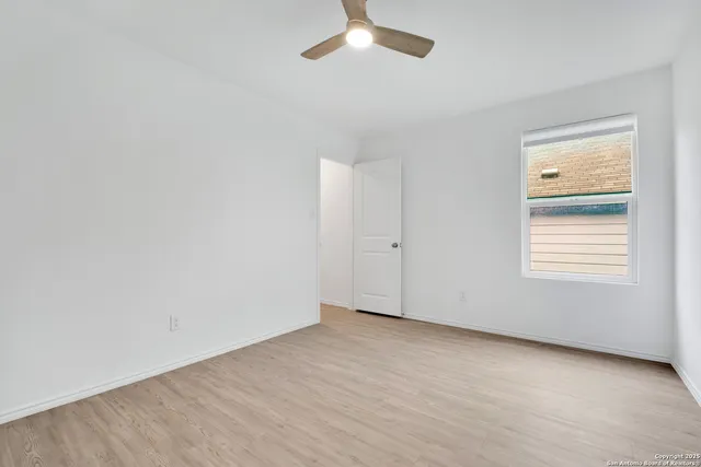 an empty room with a empty space and a window