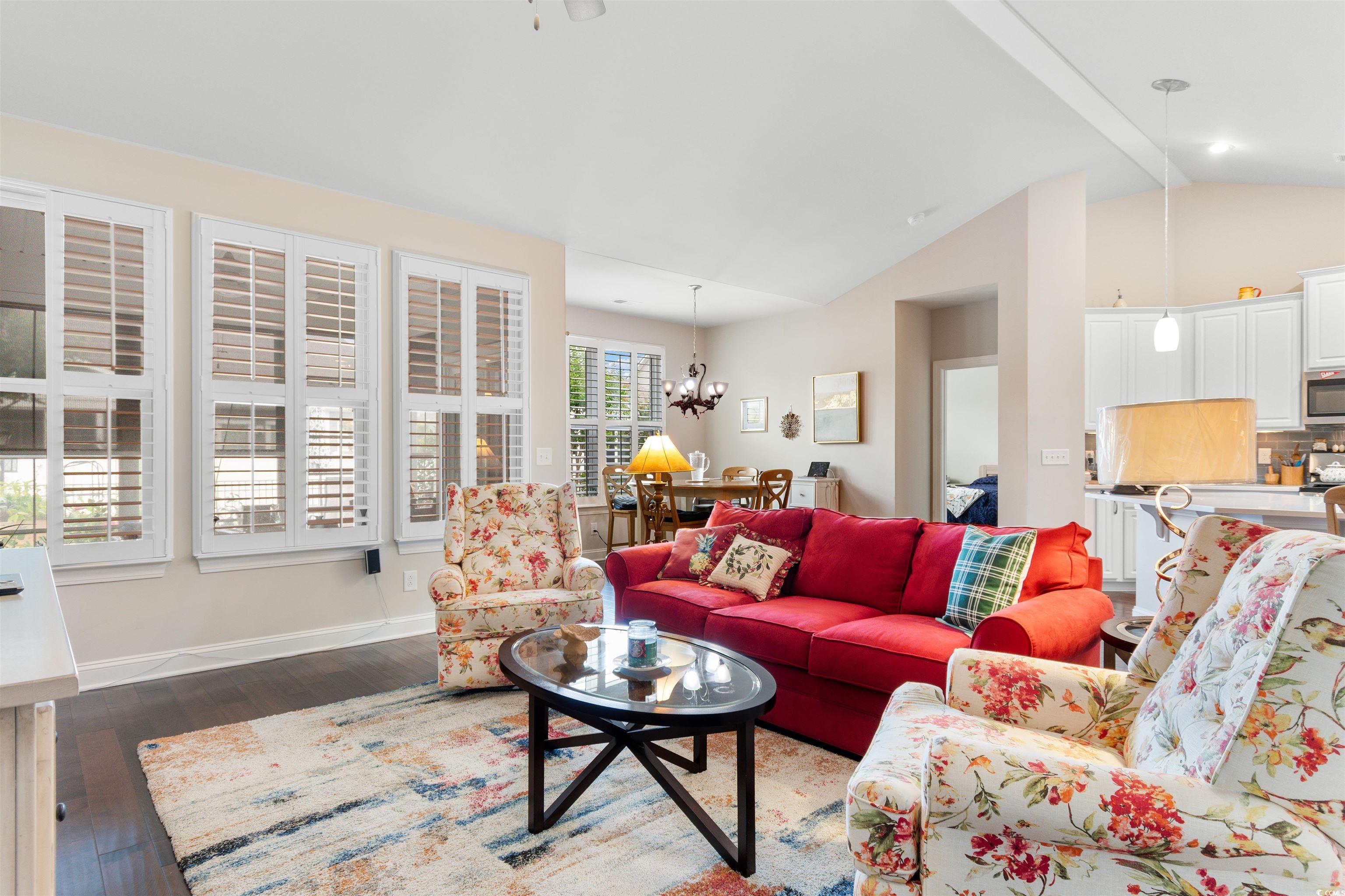 765 Berkshire Avenue Myrtle Beach, SC 29577 - Photo 15 of 40 Living room featuring a chandelier, hardwood / wood-style floors, and baseboards